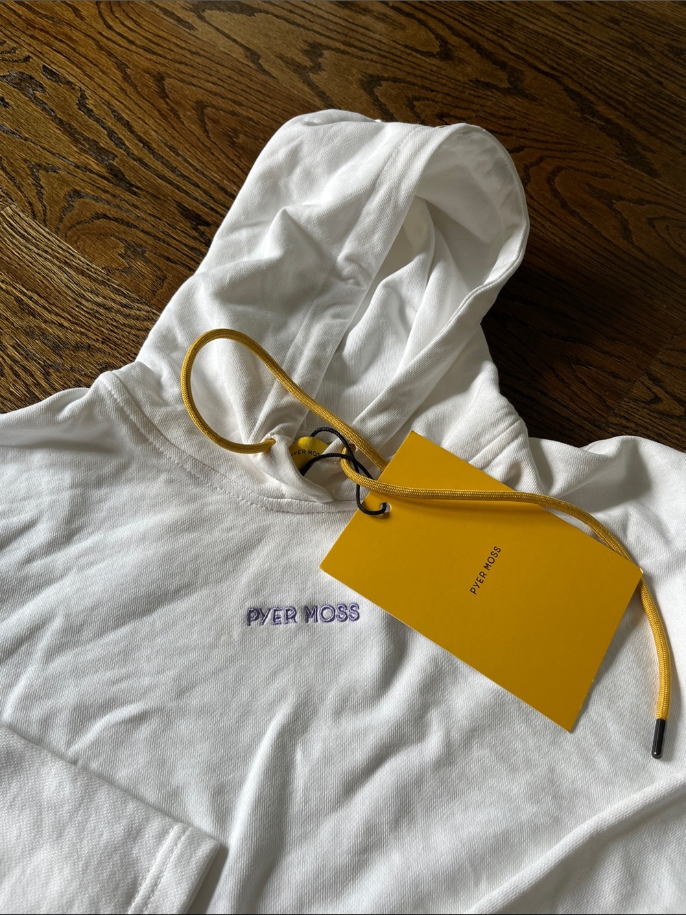 Pyer Moss White Cropped Bell Sleeve Hoodie with Yellow Tag and Purple Embroidery